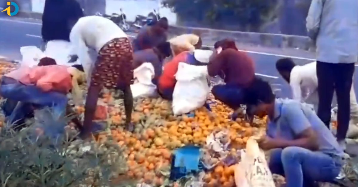 Orange fruit lorry overturned